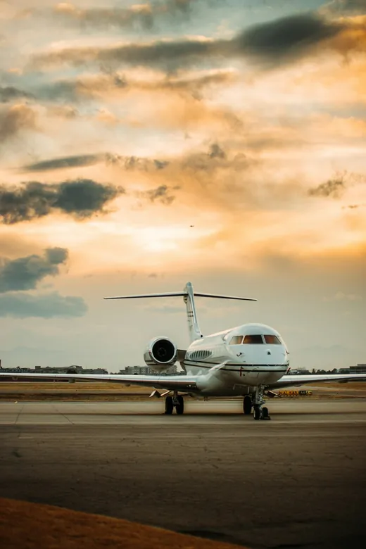 Private jet on the ramp at El Monte Airport at sunset