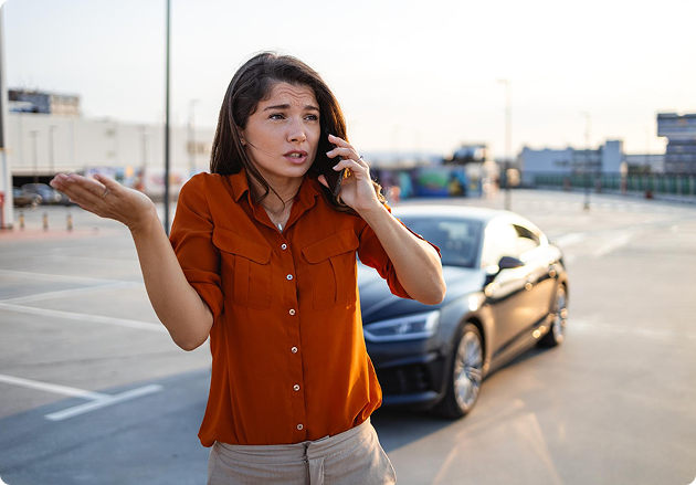 Frustrated traveler in a parking lot