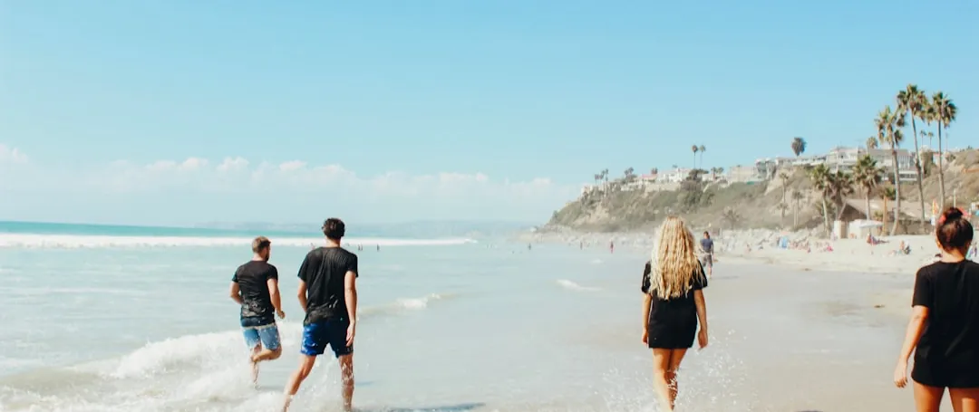 A group walking together along the shoreline