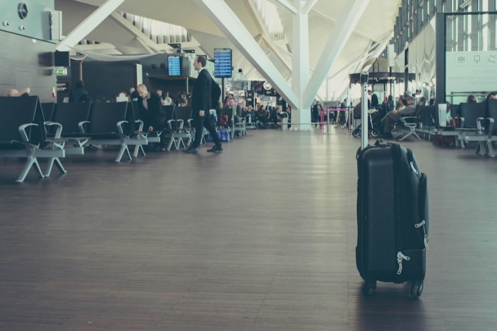 Travelers with luggage at the airport